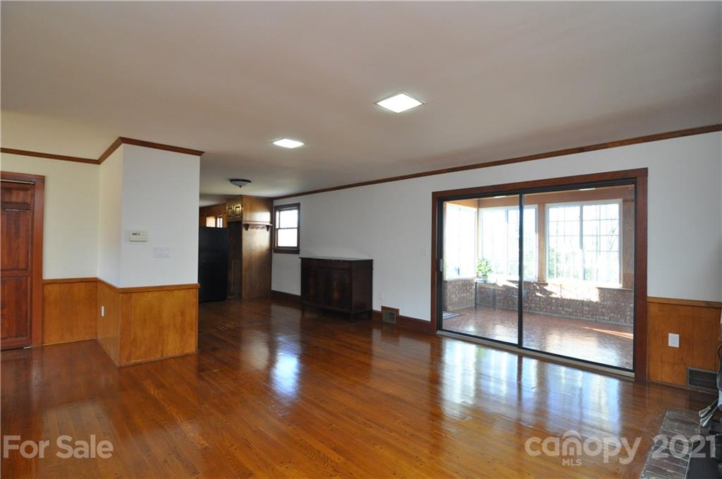 1011 Redland Road Landrum, SC 29356 - Photo 23 of 45 a view of empty room with wooden floor
