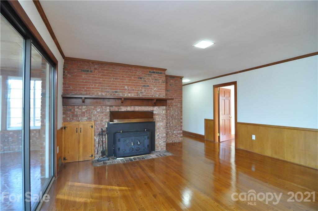 1011 Redland Road Landrum, SC 29356 - Photo 24 of 45 a view of a livingroom with a fireplace and window