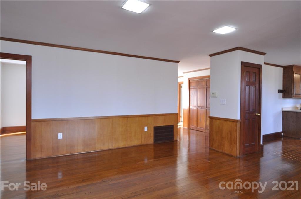 1011 Redland Road Landrum, SC 29356 - Photo 25 of 45 a view of an empty room with wooden floor