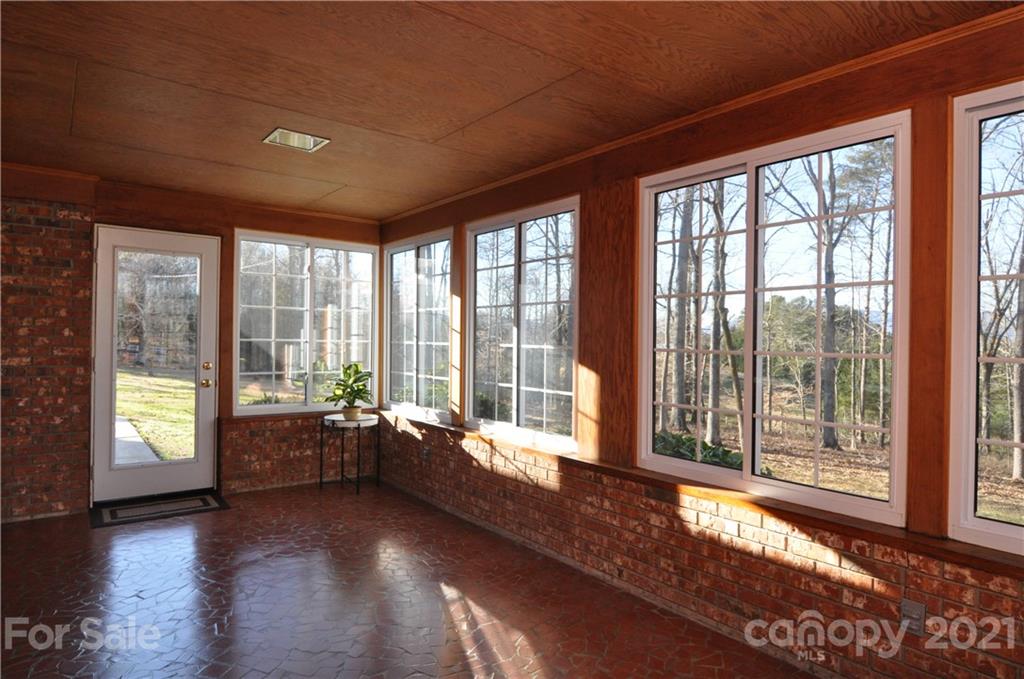 1011 Redland Road Landrum, SC 29356 - Photo 26 of 45 a living room with hardwood floor and large windows