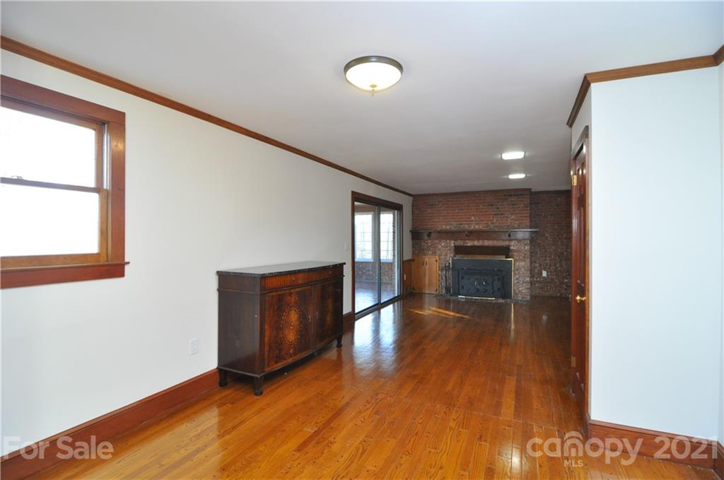 1011 Redland Road Landrum, SC 29356 - Photo 28 of 45 a view of empty room with wooden floor and fan