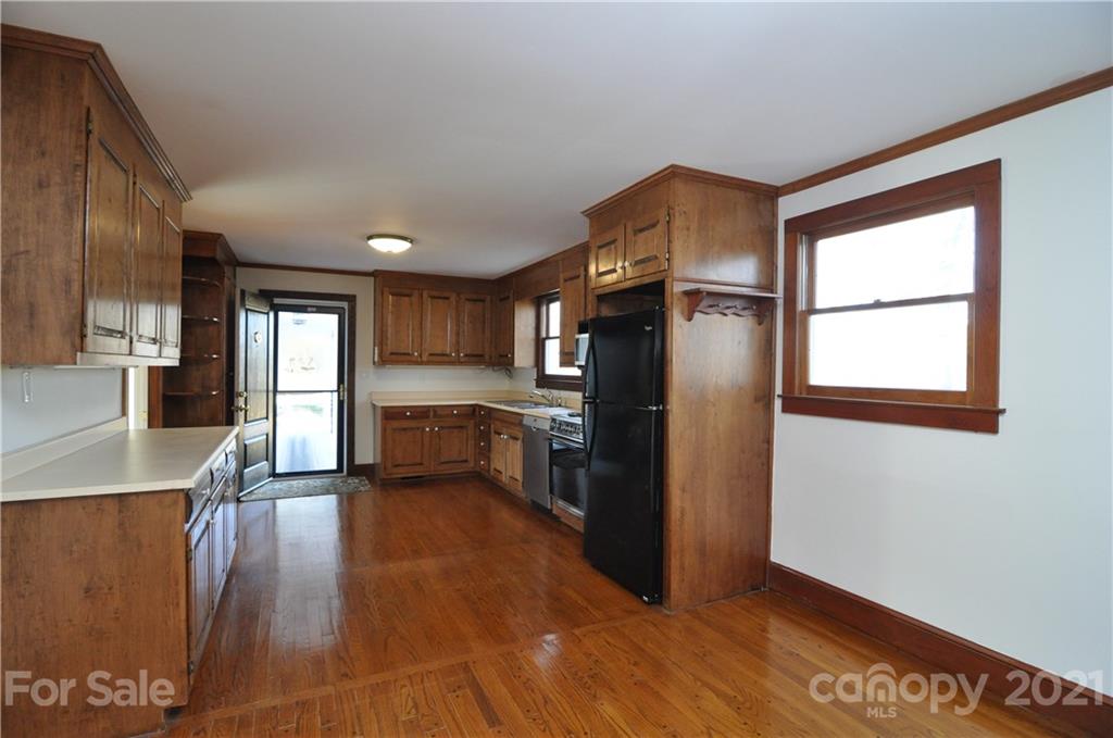 1011 Redland Road Landrum, SC 29356 - Photo 30 of 45 a view of a kitchen with wooden floor and electronic appliances