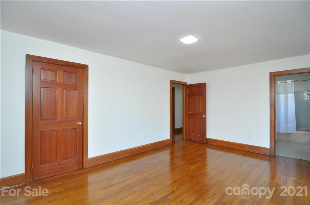 1011 Redland Road Landrum, SC 29356 - Photo 36 of 45 an empty room with wooden floor & closet area