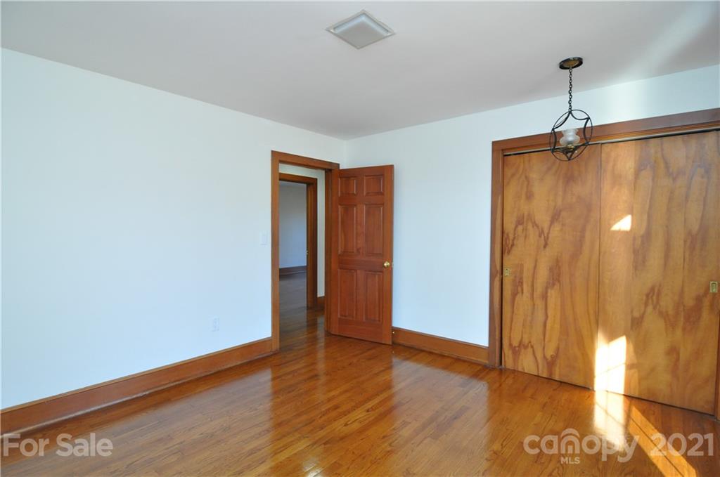 1011 Redland Road Landrum, SC 29356 - Photo 43 of 45 a view of empty room with wooden floor