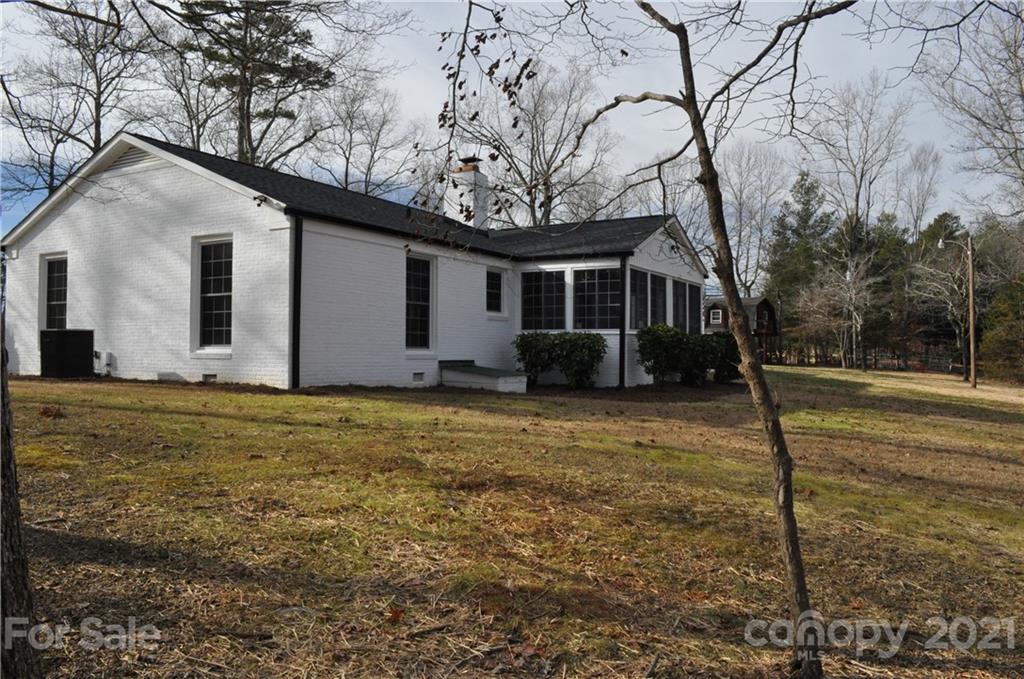 1011 Redland Road Landrum, SC 29356 - Photo 7 of 45 a house with trees in the background