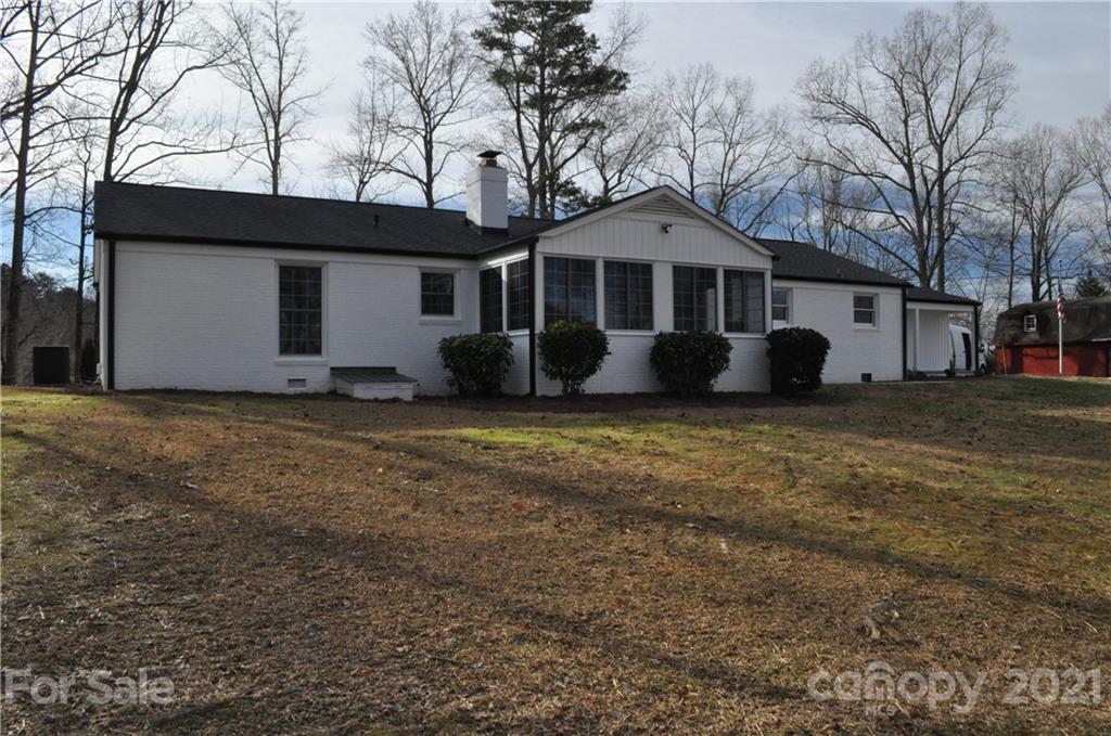 1011 Redland Road Landrum, SC 29356 - Photo 8 of 45 a front view of a house with a yard