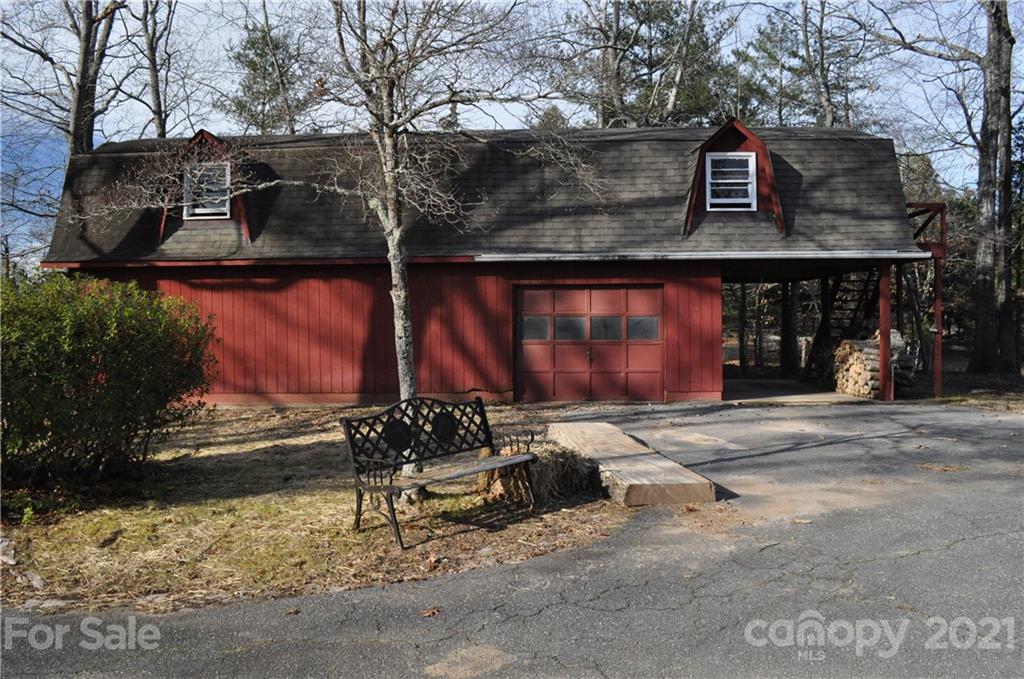 1011 Redland Road Landrum, SC 29356 - Photo 10 of 45 a view of a building with a bench in front of building