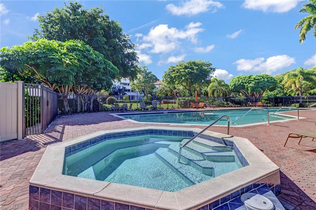 400 La Peninsula Boulevard, Unit 404 Naples, FL 34113 - Photo 16 of 19 a view of a yard with furniture