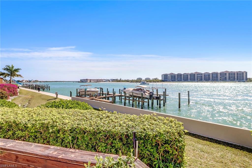 400 La Peninsula Boulevard, Unit 404 Naples, FL 34113 - Photo 2 of 19 a view of a lake with a city view