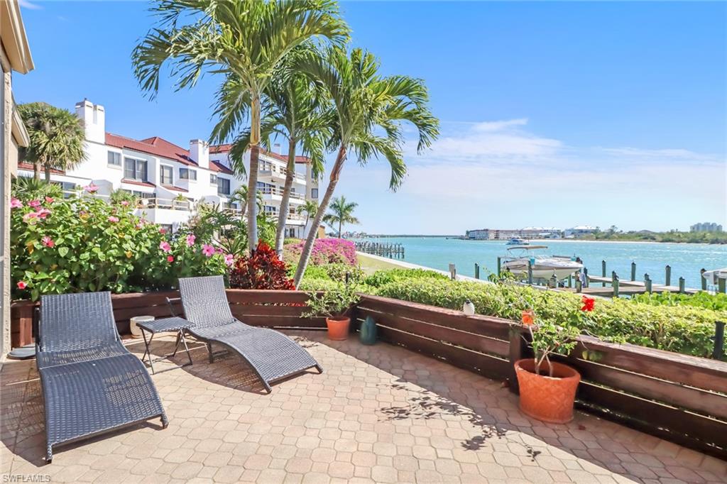 400 La Peninsula Boulevard, Unit 404 Naples, FL 34113 - Photo 3 of 19 a view of a terrace with couches and potted plants