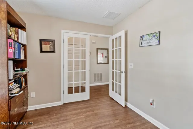 a view of livingroom with furniture and workspace