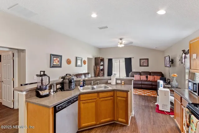 a kitchen with a stove and a refrigerator
