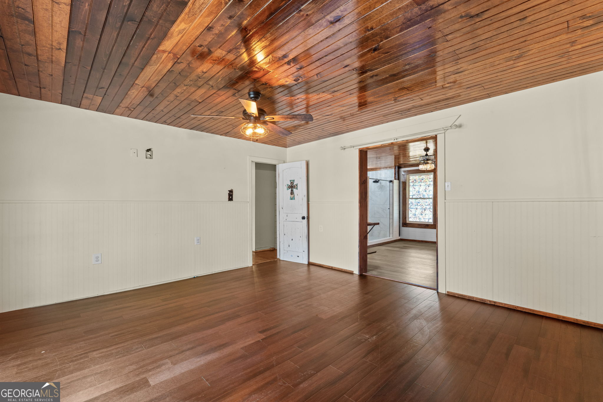 49 Frost Road Bowdon, GA 30108 - Photo 21 of 60 a view of an empty room with wooden floor