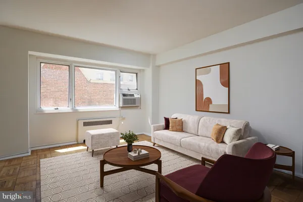 a living room with furniture and a window