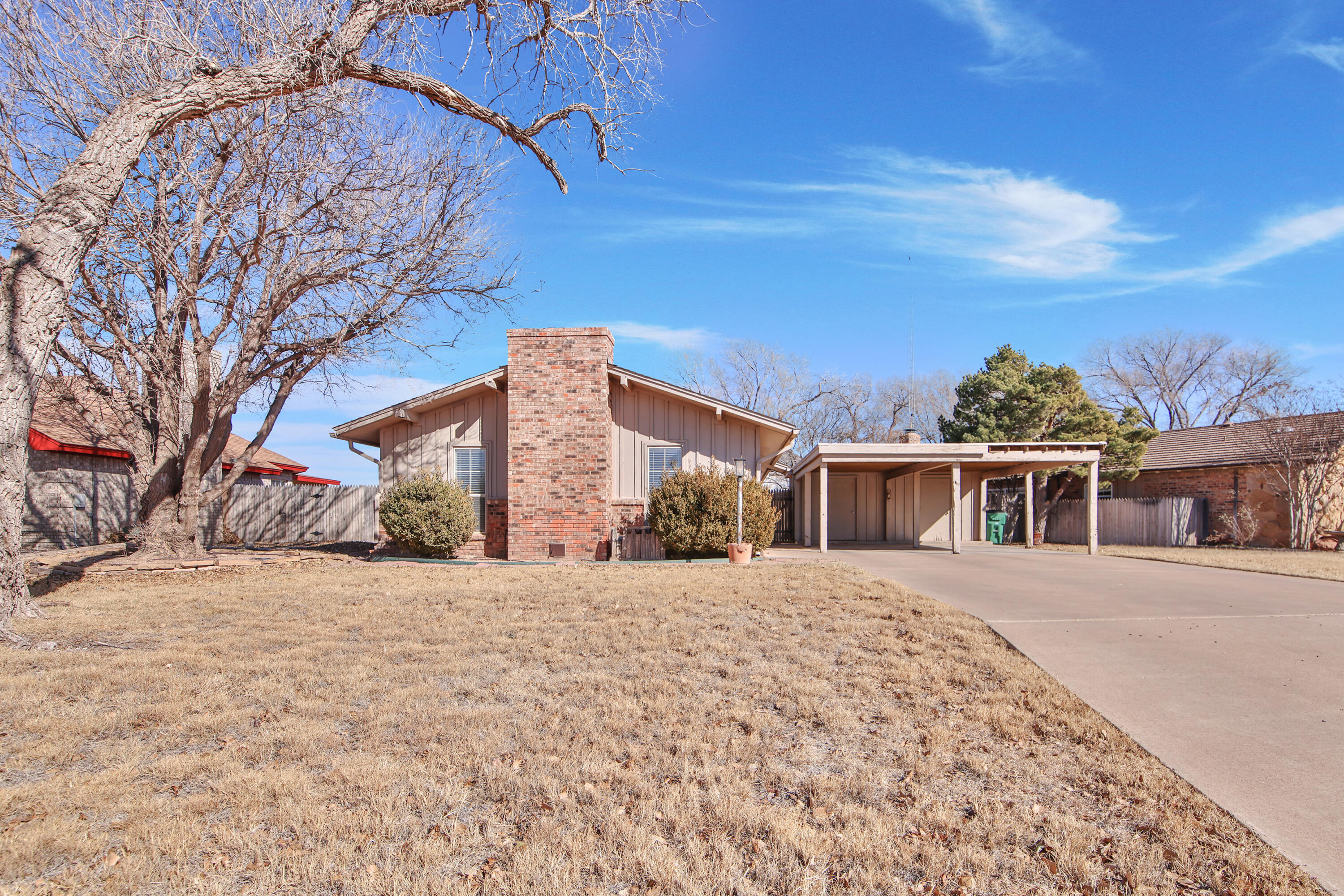 18 Highland Drive Ransom Canyon, TX 79366 - Photo 2 of 28 a front view of a house with a yard