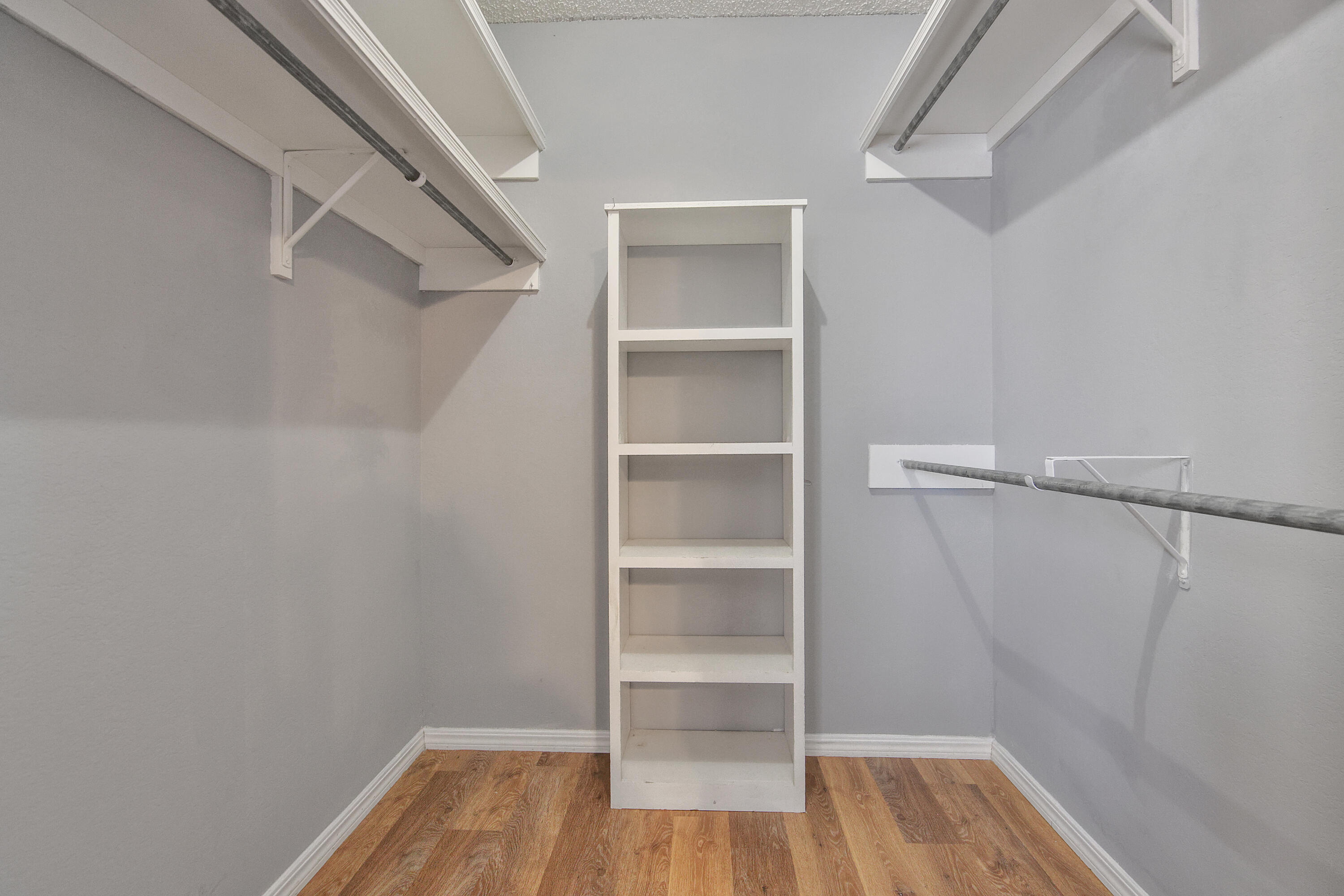 18 Highland Drive Ransom Canyon, TX 79366 - Photo 21 of 28 a view of walk in closet with empty racks