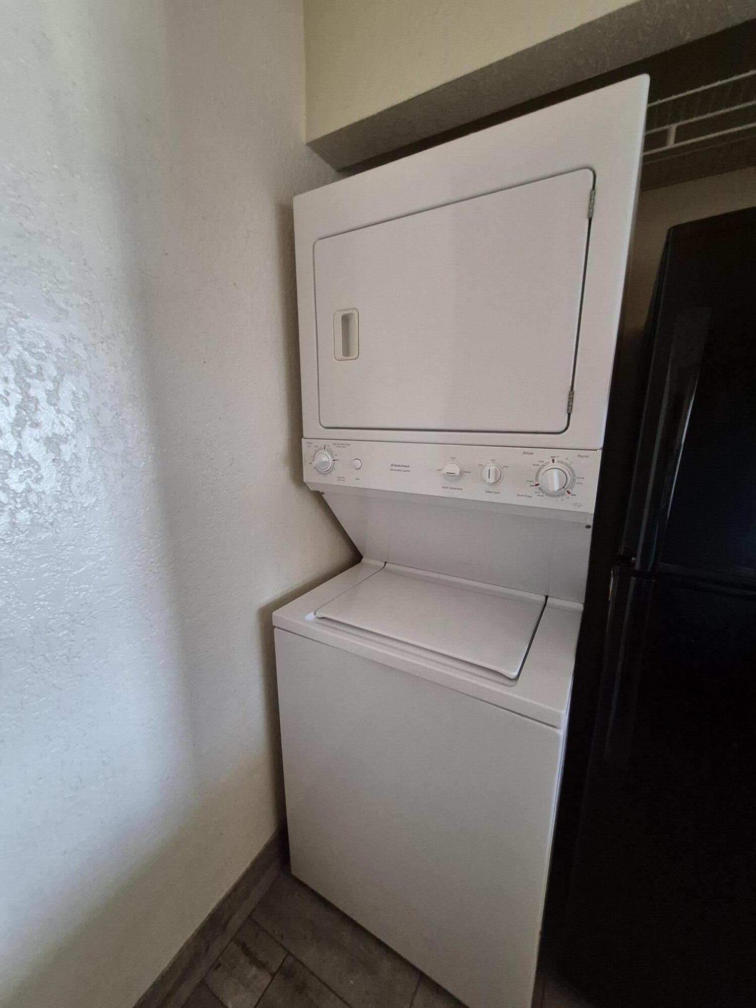10039 Winding Lake Road, Unit 202 Sunrise, FL 33351 - Photo 8 of 14 a utility room with dryer and washer