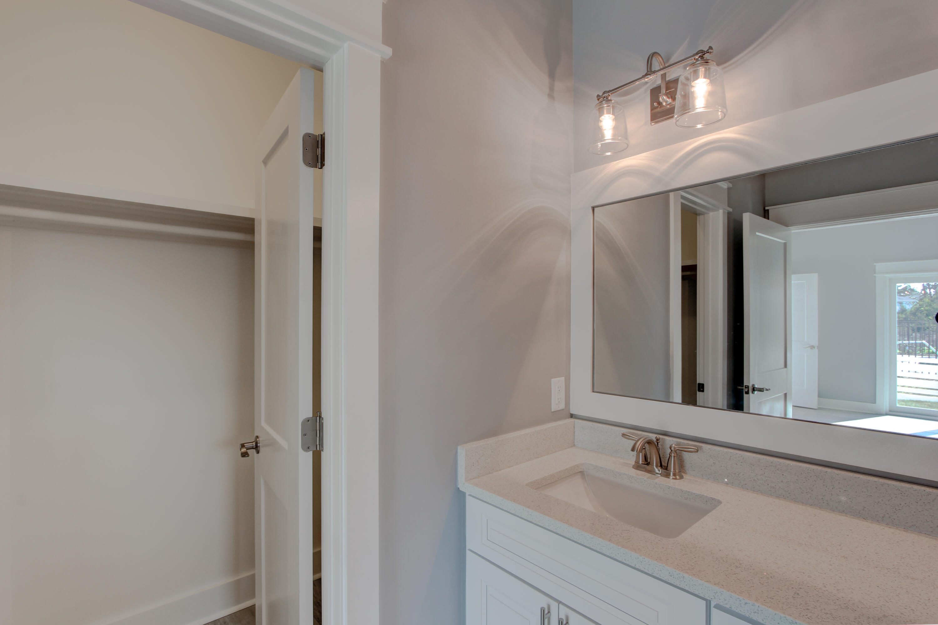 49 Seaview Dr Inlet Beach Inlet Beach, FL 32461 - Photo 10 of 38 a bathroom with a sink and a mirror