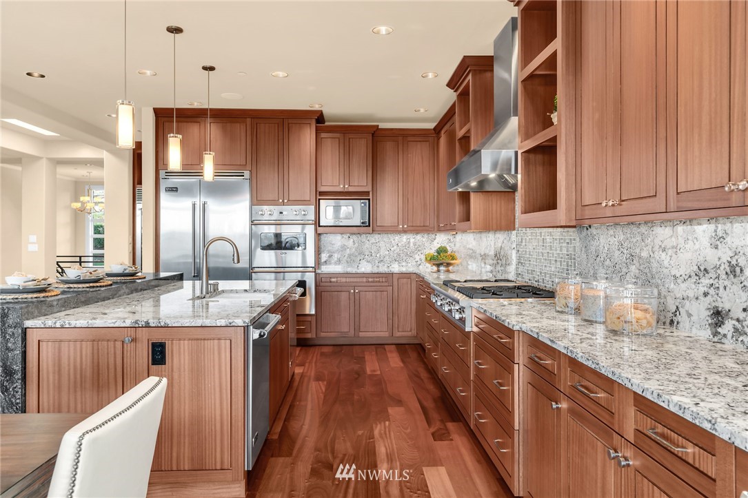 8477 Ridge Road Medina, WA 98039 - Photo 5 of 24 a kitchen with stainless steel appliances granite countertop a sink stove and refrigerator