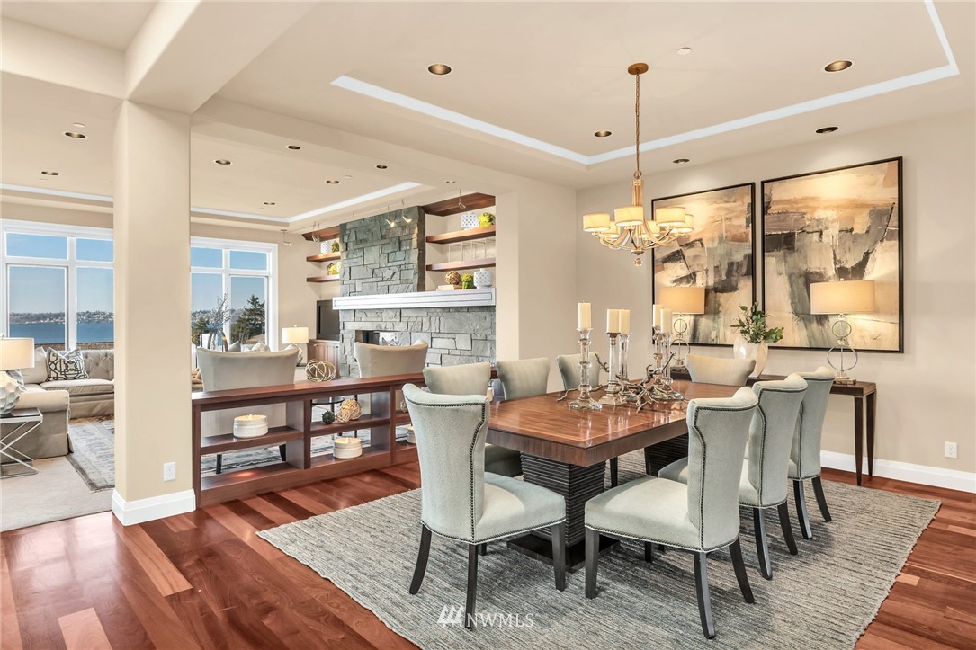 8477 Ridge Road Medina, WA 98039 - Photo 8 of 24 a dining room with furniture a chandelier and wooden floor
