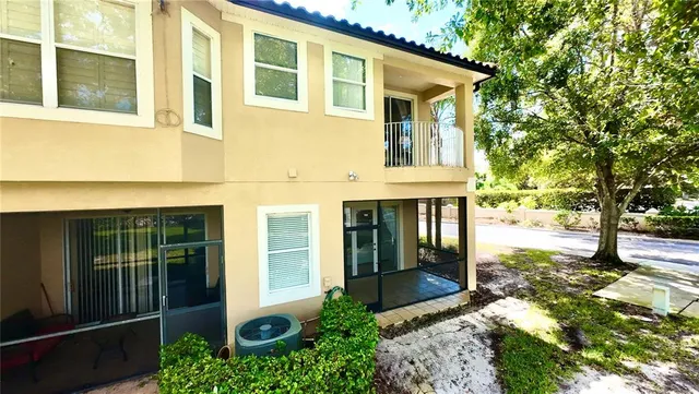a view of a backyard with trampoline