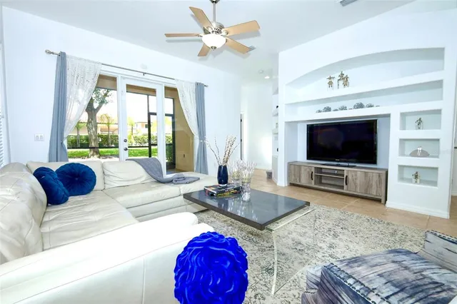 a living room with a flat screen tv and a fireplace