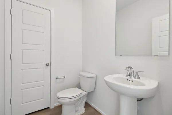a spacious bedroom with a bed and a flat screen television