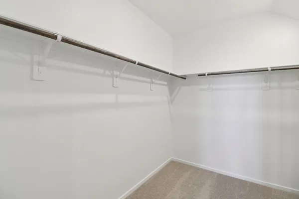 an empty room with a empty space and windows