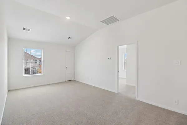 a bedroom with bed and a couch