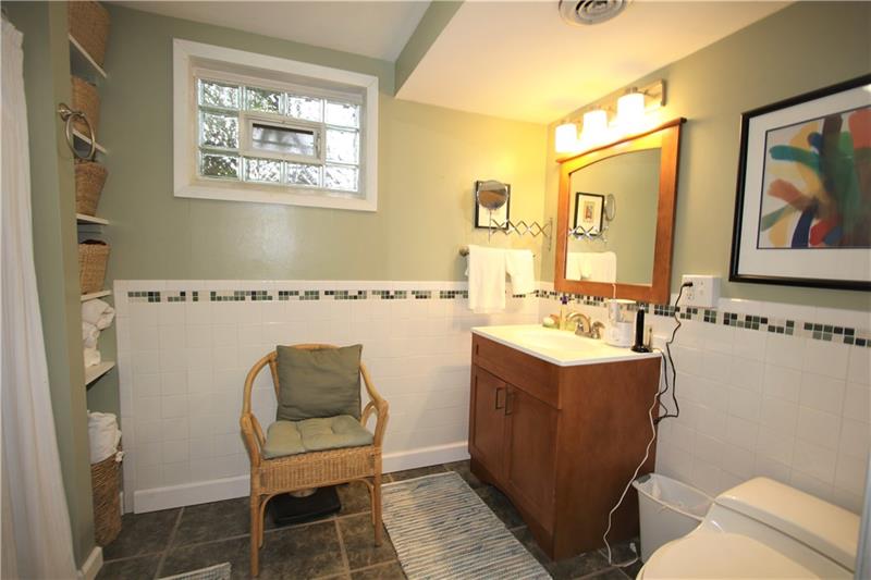 111 Taylor Run Road Monongahela, PA 15063 - Photo 16 of 25 Updated Full Bathroom in Lower Level In-Law Suite w/ Ceramic Tiled Floors & Walls plus Attractive Vented Glass Block Window!