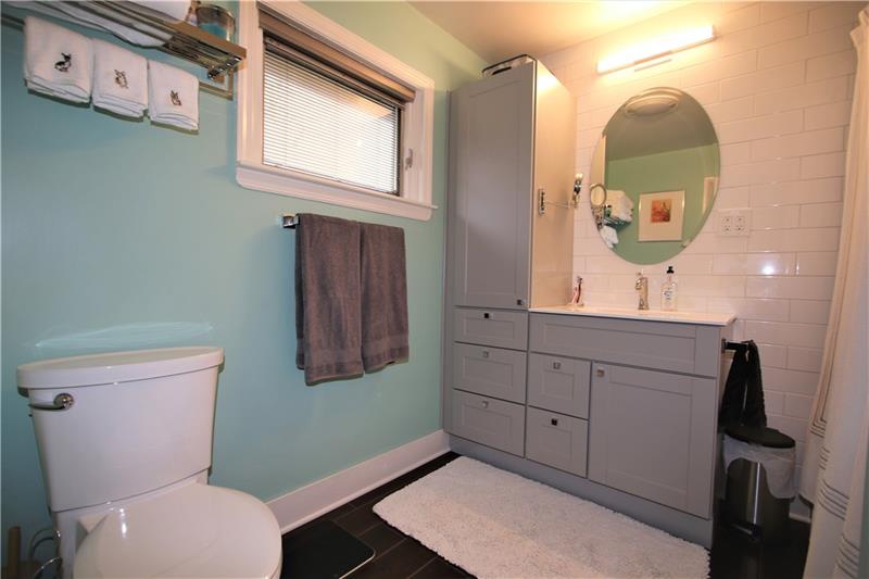 111 Taylor Run Road Monongahela, PA 15063 - Photo 18 of 25 Gorgeous Master Full Bathroom w/ Subway Ceramic Tile on Wall & Extra Long Tub plus Ceramic Tiled Floors (1 yr young). Built-in Blinds in Window & Unique Barn~Style Door also featured in Hallway Updated Bathroom too!