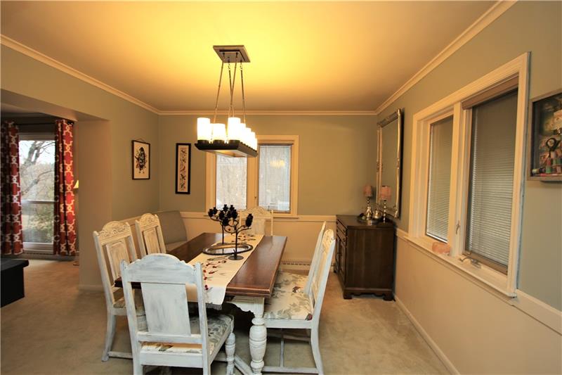 111 Taylor Run Road Monongahela, PA 15063 - Photo 3 of 25 Roomy 14x11 Separate Formal Dining Room w/ Attractive Candle-Style Chandelier on Dimmer & 4 Windows offering Built-in Blinds allowing the Natural Light to Flow through-out the Home Nicely! (all windows are appx 15 yrs except for Living Room & Game Room Floor to Ceiling which were replaced June of 2019)