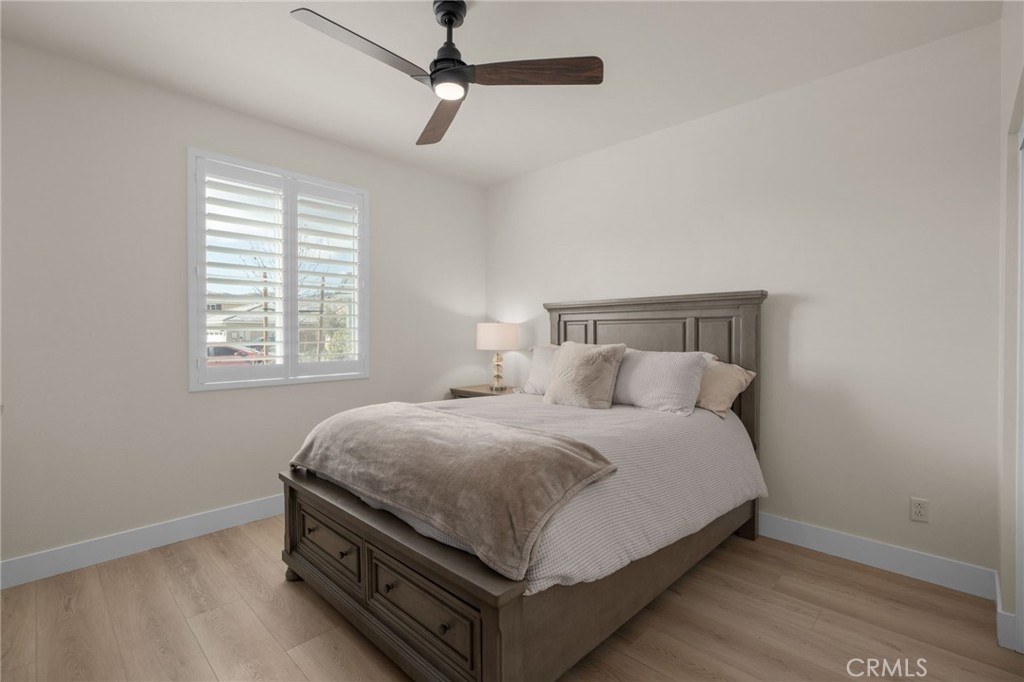 34972 South Serrano Square Yucaipa, CA 92399 - Photo 17 of 48 a bedroom with bed and window