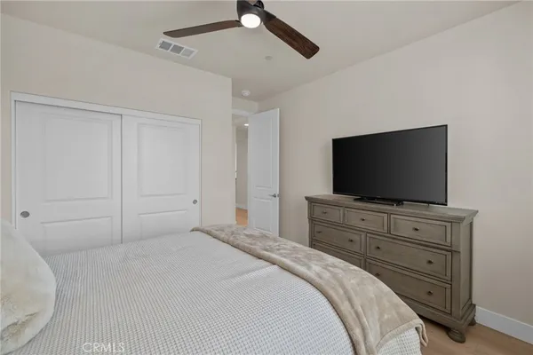 a bedroom with bed and window