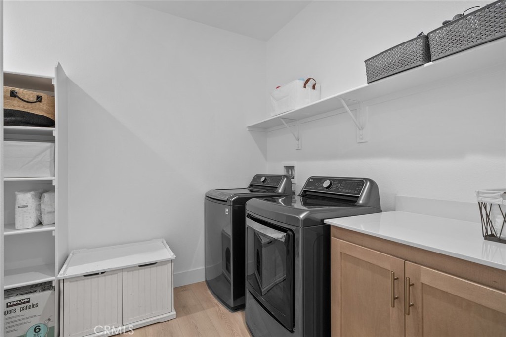 34972 South Serrano Square Yucaipa, CA 92399 - Photo 20 of 48 a utility room with sink dryer and washer