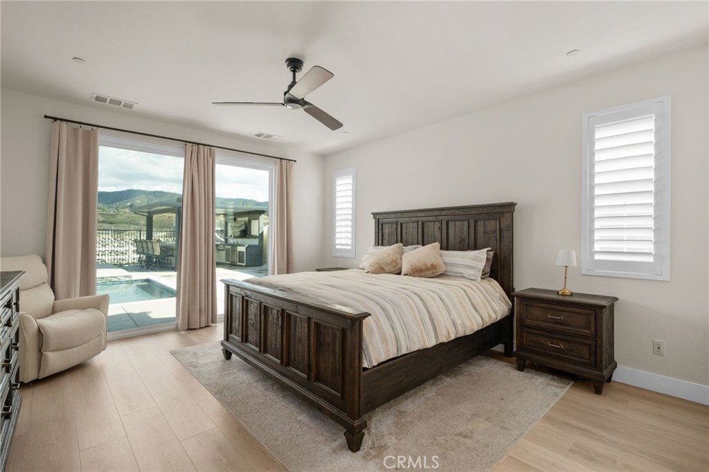 34972 South Serrano Square Yucaipa, CA 92399 - Photo 22 of 48 a bed room with a bed and a couch