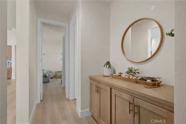 a view of walk in closet with clothes