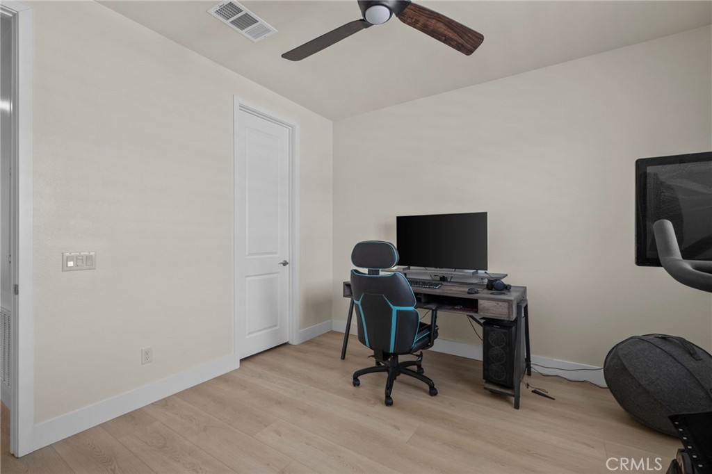 34972 South Serrano Square Yucaipa, CA 92399 - Photo 36 of 48 a view of a workspace with furniture and a window