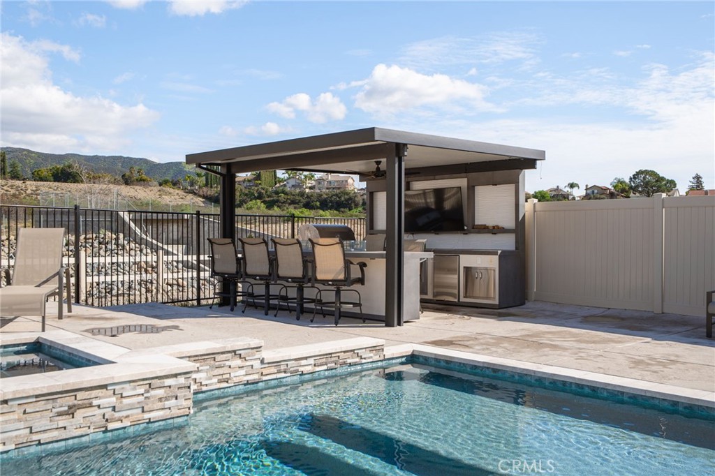 34972 South Serrano Square Yucaipa, CA 92399 - Photo 4 of 48 a view of a house with a swimming pool and sitting area