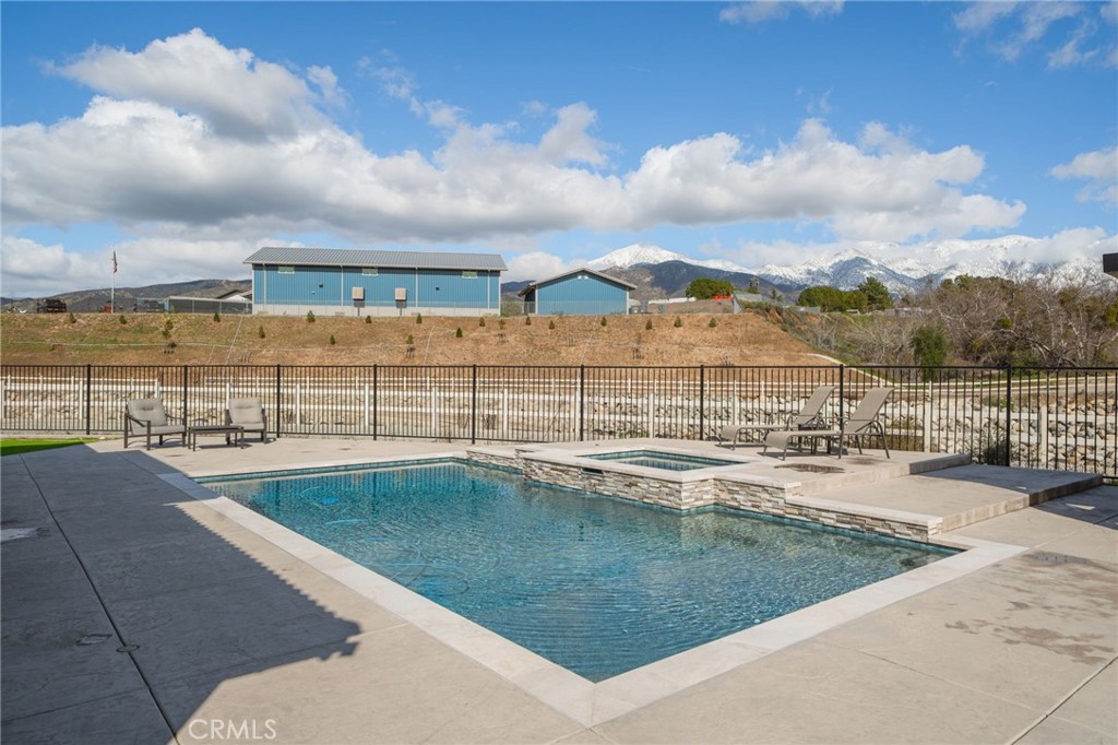 34972 South Serrano Square Yucaipa, CA 92399 - Photo 40 of 48 a view of a swimming pool with an outdoor seating