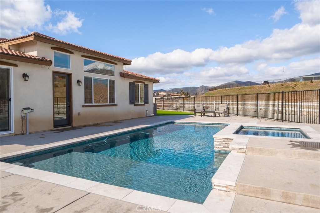 34972 South Serrano Square Yucaipa, CA 92399 - Photo 44 of 48 a view of a house with a swimming pool
