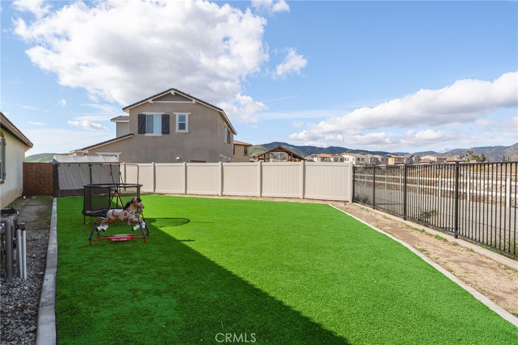34972 South Serrano Square Yucaipa, CA 92399 - Photo 45 of 48 a house view with a garden space