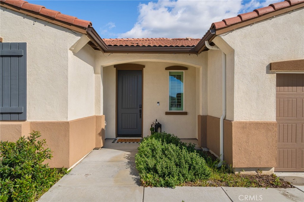 34972 South Serrano Square Yucaipa, CA 92399 - Photo 6 of 48 a view of a house with potted plants