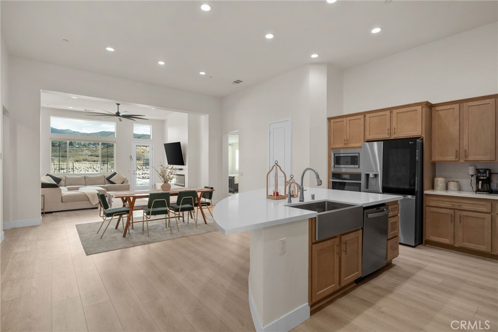 34972 South Serrano Square Yucaipa, CA 92399 - Photo 48 of 48 a kitchen with stainless steel appliances kitchen island granite countertop a sink and cabinets
