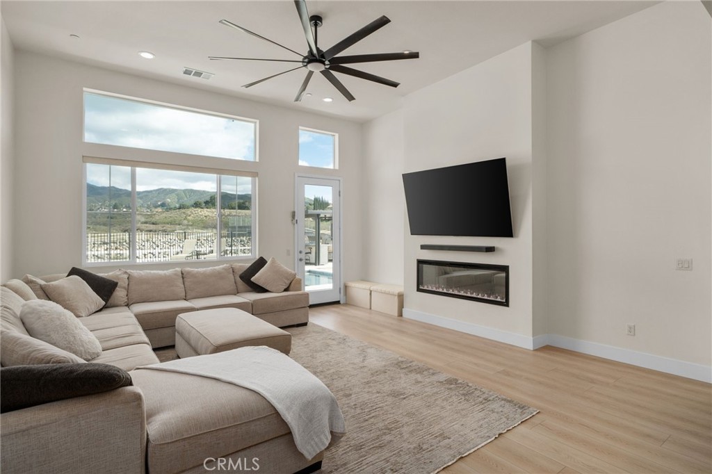 34972 South Serrano Square Yucaipa, CA 92399 - Photo 8 of 48 a living room with furniture and a flat screen tv