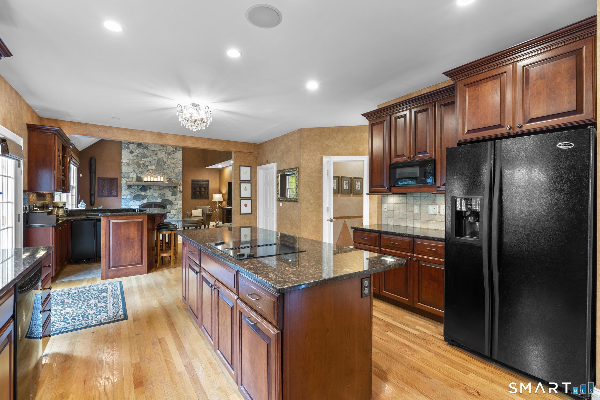 12 Logans Way Danbury, CT 06811 - Photo 3 of 40 a kitchen with stainless steel appliances granite countertop a refrigerator a stove and a sink