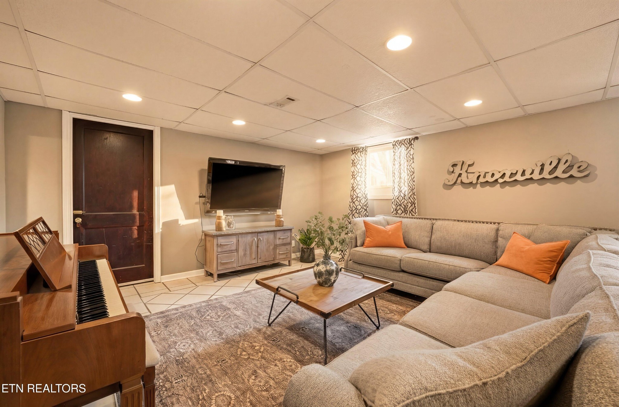 6911 Nubbin Ridge Drive Knoxville, TN 37919 - Photo 27 of 46 a living room with furniture and a flat screen tv