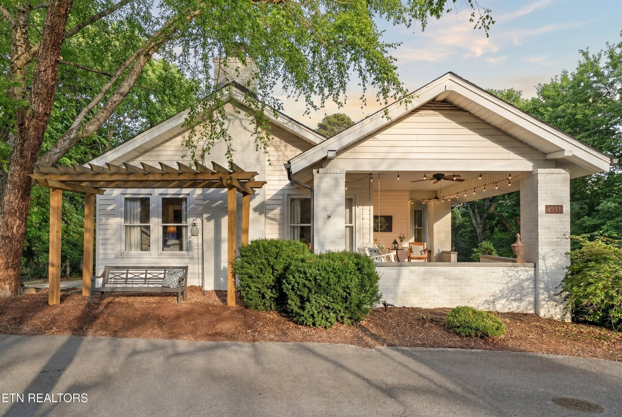6911 Nubbin Ridge Drive Knoxville, TN 37919 - Photo 6 of 46 a front view of a house with a garden and plants
