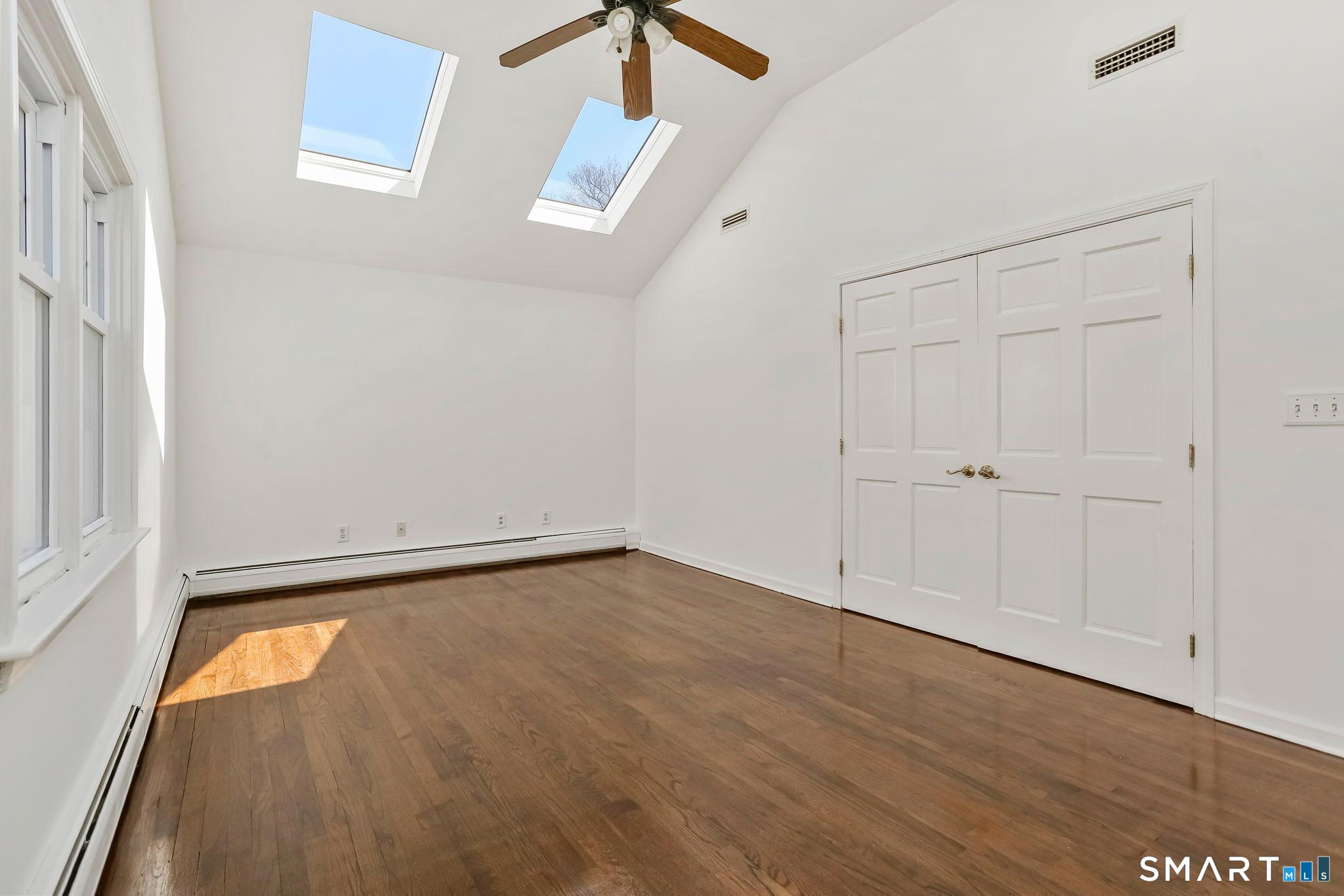 195 Post Oak Road Stratford, CT 06614 - Photo 15 of 32 Primary Bedroom with large closet and skylights