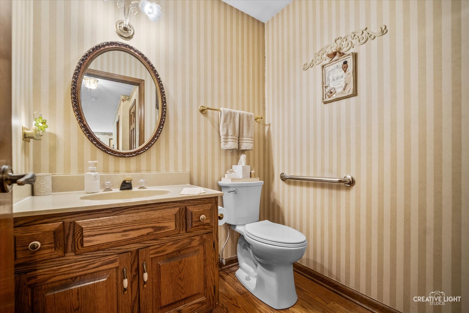 3112 Turnberry Road St. Charles, IL 60174 - Photo 7 of 43 a bathroom with a toilet a sink and a mirror